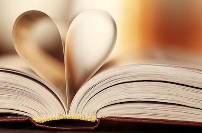 book open with pages folded into heart shape